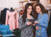 Two young designers work together using a tablet.